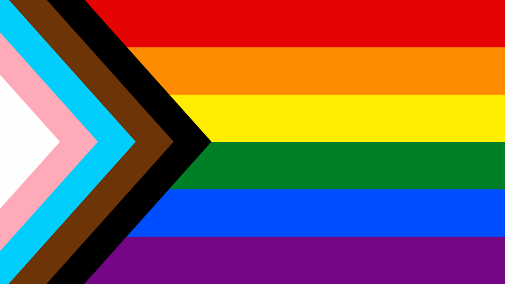 Bandiera arcobaleno con freccia inclusiva, simbolo di amore e accettazione a Torino.